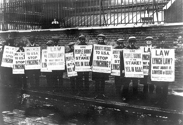 British NAACP protesters with anti-lynching posters.
