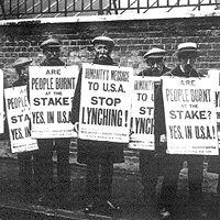 British NAACP protesters with anti-lynching posters.