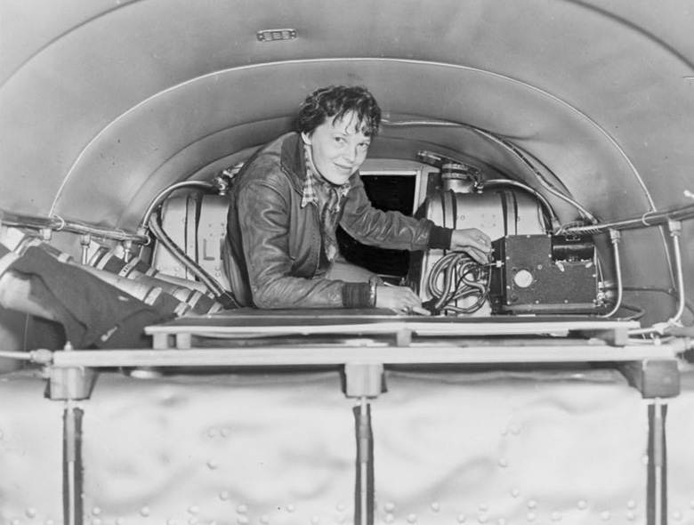 Amelia Earhart checks her equipment.