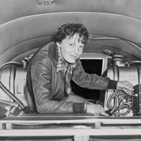 Amelia Earhart checks her equipment.
