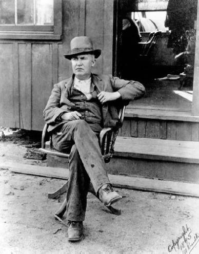 Photo of Edison Sitting at the Door of the Ore-milling Plant; Ogdensburg, NJ, 1895.