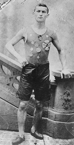 Ehrich Weiss wearing track team medals, 1890.