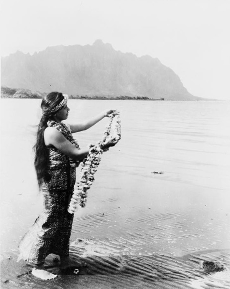 Photo of Hawaiian woman with lei on the beach