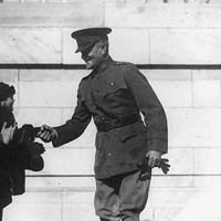 Pershing shaking hands with admirers