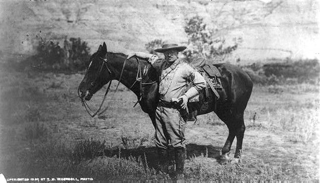 Theodore Roosevelt wearing cowboy outfit, 1910.