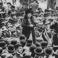 Harriot Stanton Blatch speaking to large crowd of men, Wall Street, New York City.