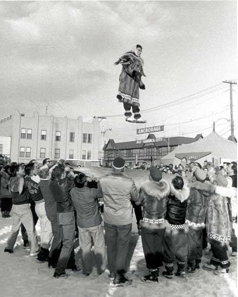 Photo of woman being tossed in the air