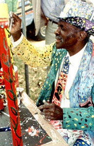 Photo of a man in a painted suit painting