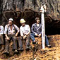 Photo of loggers sitting on a tree