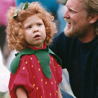 Photo of child in strawberry costume