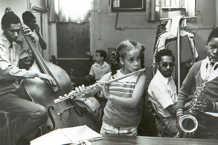Photo of children and adults playing instruments