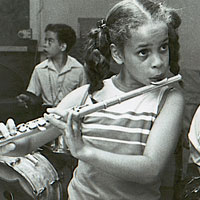 Photo of children and adults playing instruments
