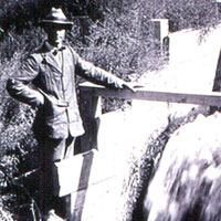 Photo of man at irrigation headgate