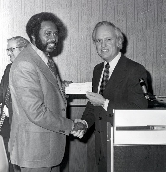 Photo of Governor Carroll presenting check to W.C. Young