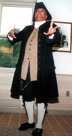 Photo of standing man in period costume