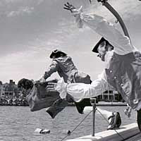 Photo of men in period clothing being thrown overboard