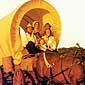Photo of a family in a horse-drawn covered wagon