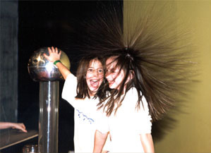 Photo of two girls, one with her hair standing on end