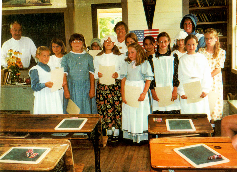 Photo of students in period clothing receiving Certificate of Merit