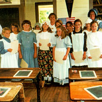 Photo of students in period clothing receiving Certificate of Merit