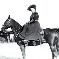 Photo of May Manning Lillie on a horse