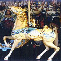 Photo of a gold and blue horse on a carousel