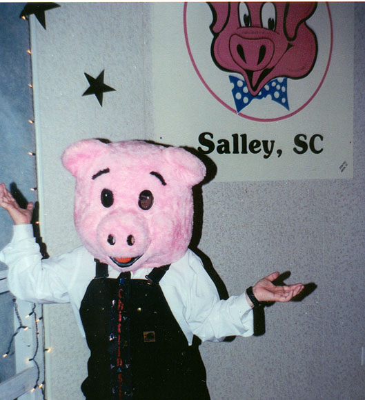 Photo of Melissa Black in a pig costume, November 1999
