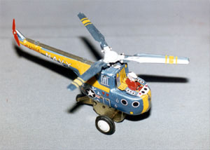 Photo of a blue and yellow toy helicopter