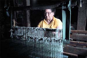 Photo of woman working a loom