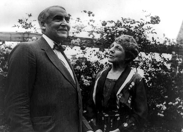 Pres. Warren G. Harding with his wife in garden