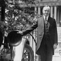 Calvin Coolidge with radio equipment used on automobiles during the campaign