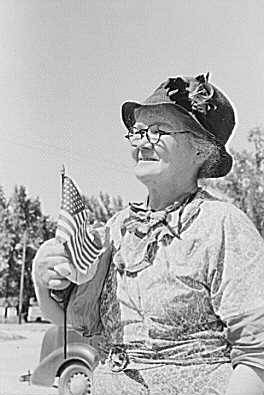 She has been shopping and bought a flag for the Fourth of July, Caldwell, Idaho, 1941.