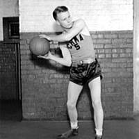 Early basketball player with a ball