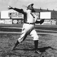 Cy Young throwing a baseball, 1908.
