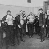Inspection room, Ellis Island, between 1900 and 1915.