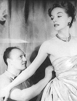 Portrait of Pierre Balmain and Ruth Ford making a dress.