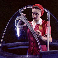 Girl putting finishing touches on the bombardier nose section of a B-17F navy bomber