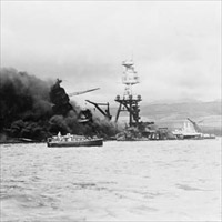 U.S.S. Arizona at height of fire, following Japanese aerial attack on Pearl Harbor, Hawaii.