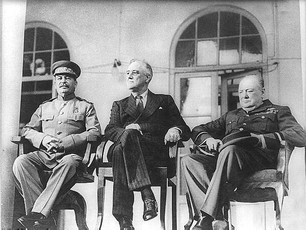 Roosevelt, Stalin, and Churchill on portico of Russian Embassy in Teheran, during conference.