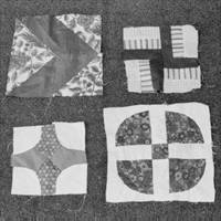 A group of four blocks made up of smaller pieces