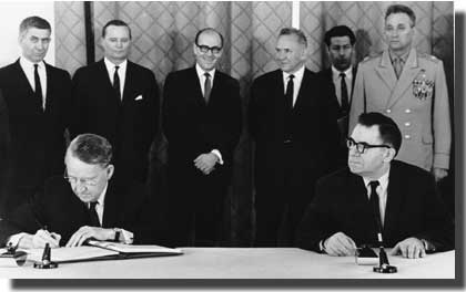 U.S. Ambassador Liewellyn E. Thompson, left, signs the Nuclear Non-Proliferation Treaty in Moscow