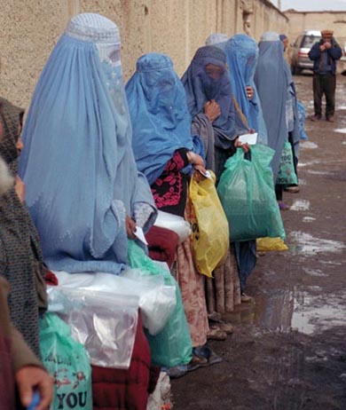 women waiting for coal distribution