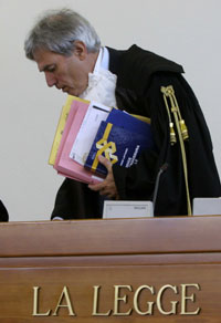 A judge leaves his bench during a criminal trial in Rome, 2005. The judge's costume reflects centuries of legal tradition.