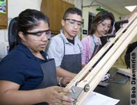 Working on a high school physics experiment in Hidalgo, Texas. 