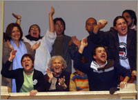 Members of rights groups cheer in the Argentine Congress following a vote against human rights abusers.  