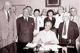 President Franklin D. Roosevelt signs the legislation of the New Deal: the Social Security Act of 1935.