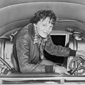 Amelia Earhart checks her equipment.