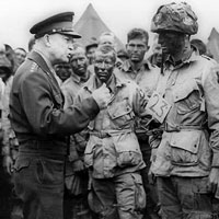 Photograph of General Dwight D. Eisenhower and D-Day paratroopers.
