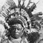 Black and white photo of men in traditional tribal dress