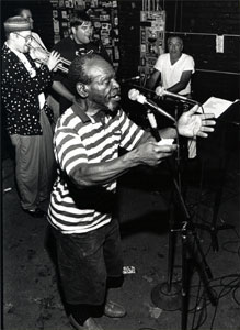 Photo of Doc Tomato and band performing